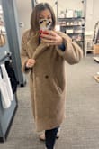 I was incredibly pleased with the coat! It is beautiful and comfortable. Well lined. The only negative was that one of the two buttons fell off the first day I wore it. Fortunately there was a spare button. - Michelle B.