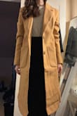 I love the look of this coat! I am a very tiny person, so oversized coats can look ridiculous on me, but I think this one (I purchased in XXS) is on the right side of oversized that it looks fashionable rather than like a child playing dress-up in dad's coat. However, it is nowhere near as heavy as some of my other dress coats, and I knew right away as I picked it up still in its dust bag that it was very light weight. Definitely more of a fall/spring coat rather than something I would normally choose to wear in sub-32 degree northeastern temps. It's roomy enough that I could comfortably layer underneath (I normally wear a sweater and a suit blazer) so I may still get use out of it this winter. - Emily K.