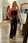 Bought this outfit for Vegas and it's super cute! The pants hug the waist a little due to the elastic in the waist band- size up- if you're concerned about that! The top fit perfectly- was worried if I sized up on the pants- that the top would be too big. Overall, highly recommend! Can't wait to wear it! - Camille D.