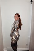 When I saw this dress I knew I needed it for NYE! I ordered a size up (L) from my normal size (M) and it fit perfectly! I have an athletic build, so I sized up to make sure it would fit my thighs and butt. Even when sitting down the sequins stayed in tact. Only a few fell off while wearing the whole night. Recommend for your next party! - Madison D.