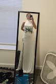 I will be wearing Lulus Captured Your Heart White Halter Maxi Dress for my wedding, and I already know it will be the perfect choice. The dress is stunning, elegant yet simple, with a flattering halter neckline that will give it a modern twist. The fabric is great, and it will create a dreamy silhouette as I walk down the aisle. I plan to add a flower belt to personalize the look, which will enhance the romantic feel of the dress. I'm sure the delicate details combined with the softness of the belt will make me feel like a true bride. I'm so excited to wear it, and I have no doubt I'll receive countless compliments on how beautiful and timeless it looks! - Emily W.