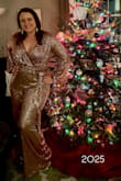 Color is a little more bronze than the pink in the picture but I still liked it. I wore this for new years. Surprisingly comfy even with the sequins since your arms are fully protected. I used tape to secure the neckline, without doing so it would have flapped open and felt uncomfortable. I'm happy with the look though, so still giving it 4 stars. Also, the legs were very long which worked great for heels, but I was swimming in them once I took them off. - ABIGAIL H.