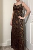 I was not pleased with how the dress came based on the picture advertised. I am almost always a medium and this dress was very baggy. It wasn't fitted anywhere. The color was more brown than purple. I returned it. - Josie K.