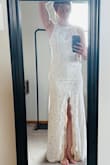 The photos dont do it justice, but I havent gotten married yet, so I dont have great pics. I wouldnt say the dress runs small, but it fits tight. It is absolutely stunning on, though! The neck is a little loose, so I plan on altering that myself, and I also want to sew the nude lining to the lace so it doesnt separate, as you can see in this photo. Less than $40 for a beautiful dress that only needs a couple of alterations I can easily do on my own is soooo worth it! Would definitely recommend! - Angela T.