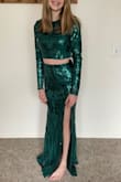 Ordered this for my daughter for Winter Formal. Fit her like a glove, with minimal wiggle room. A small would be too big on her. The midriff exposure is the perfectly appropriate amount for her age. The only complaint is that the sequin design on the skirt doesn't quite match up with the top, but it's hardly noticeable. - Brittany E.