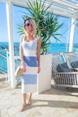 Love this dress! So comfortable and classy. Warm, thick material so the cool ocean breeze I had on my cruise wasn't a problem. This dress fits like a glove too. Lots of compliments! Love the tropical blue colors >u - Lauren T.
