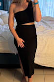 I bought this last minute for our honeymoon, and I ended up loving it! The material of this dress is stretchy, but I still ordered my usual S in Lulus, and the fit was perfect. It was very comfortable and still stylish. I'm taller, and the length was perfect too. The slit was not too much as some can be. I'm sure some would be fine wearing this without a bra, but I wore a tight bandeau underneath for my own comfort. I would recommend this one, for sure! - Brittany R.