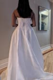 It's a nice dress but it just wasn't the "one". The cups are molded so it gives you a nice shape. I wasn't a huge fan of the embroidery but that's a personal preference. - Rosie R.