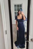 Fits true to size I am an XS in most Lulus dresses.
All Lulus dresses on me need to be hemmed as I am only 5'.
Material is standard not super thick.
The straps of the sleeves are long and will fall but might fit someone with a bigger/longer chest.
Easy to get alterations on to have desired fit. - Maria R.