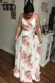 This dress is amazing! The flowy aspect is gorgeous! The boob area is a little tight, and the clasp doesn't stay together because of that, but that's a quick fix for such a beautiful dress! - Raylee D.