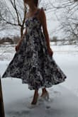This dress came very quickly and is so fun to wear! The skirt is a full circle and the fabric seems good, it has the smallest bit of stretch just from how it's woven, which helps make it comfortable.
It looks darker in my photo because of backlighting:) - Faith B.