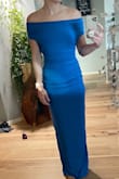 I love the concept of this dress and how it's worn. However, I bought it and others for a formal gala and it didn't look "fancy/formal" enough. The material was like a stretchy athletic wear material. Far away, it looked nicer than up close. It was quite comfortable and hid any bumps in the midsection. - Ashley B.