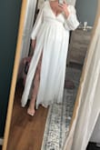 The dress was beautiful and high quality. I purchased this for my wedding but couldn't zip the full way up with a 40" band size. I am a true 40DD and there was absolutely no way anything bigger than a B cup was fitting in this. The shoulder to waist ratio was not correct and definitely needs to be modified for longer bodies. Beautiful overall just not the right fit. - Kalynn S.