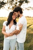 I wore this for a photoshoot when my husband proposed to me & it was perfect! We were going for a country/nature aesthetic with blue jeans and white tops and this blouse went perfectly. It's not too cropped to show the stomach but falls right at the waist. - Shelbie W.