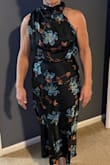 Satin material which lays nicely and fits true to size.  Need to wear shape wear with this dress.  Many compliments.  Definitely would not hesitate to order.   Great dress for older women to look polished - Cindy W.