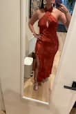 Purchased this for a wedding where the bridesmaid color is burnt orange/rust color. This dress was perfect! The material feels very nice and lux, it's heavier than most satin fabrics but in a good way (ie doesn't look cheap). The print is super favorable around the stomach area bc it hides a bit. Neckline is very nice as well. I'm curvy and was so pleasantly surprised that the dress (M) fits around my thighs without looking stretched out/ too tight. I'm normally a size 6-8 in pants (depending on stretch) and have a small waist and an M for me perfectly. - Andrea R.