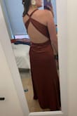 I think if the style of dress that fits you best is a "business in the front-party in the back" then this dress is for you, but it was just not doing it for me. Felt a bit bland/simple/unstructured in the front. The color is a nice like rusty mocha. I'm 5'4" and it was floor length and the criss-cross straps in the back were a bit too long. - Andrea R.