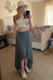 This skirt flows beautifully in the wind. I've had so many compliments on it. I also have it in black. It's very fitted in the waist and does not have any give. I did have to have this one and the black one hemmed because I'm a shorty here. - Amanda S.