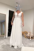 This dress was very cute and flattering on. The bottom was simple which made the top only stand out more. The only downside is the cups in the top were EXTREMELY white so they just stuck out and were very noticeable to me. - Ariel B.