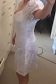 This dress is a great fit. The white party was canceled so I never worked it, but it fit perfectly and I'm short. The white is stark white which almost has a cheap tinge of gray feel, but that happens with white white. - Amy C.
