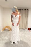 The roses are stunning. The arms are way tight. So there is very minimal movement if you want to lift up your arms due to the off-the-shoulder part being tight. It's also a very white dress, probably the whitest I tried on! - Ariel B.