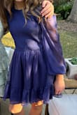 Such a pretty color, a bluish/dark purple... a unique shade that stands out from other primary color dresses.  Also, the photo shows the dress much shorter than it was for my daughter; it hit just a couple inches above her knees which was perfect for a school dress code that enforces the finger-tip rule strictly!   We couldn't have been happier with it! - Joya K.