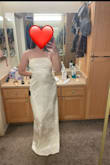 I did not have high expectations for this dress, and I purchased 10 dresses to try, but this was by far my favorite. It is so elegant, sleek, and comfortable! It maybe runs a bit on the large side, but I wouldn't size down because I personally like having the extra room. I'm going to wear this to either post-courthouse ceremony at my reception dinner and/or on our honeymoon! - Meg R.