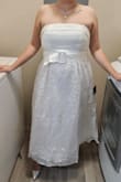 This dress is exactly what I hoped it would be. It was simple, elegant, and so stunning! I am wearing this to my wedding as we are having a small gathering of only about 20 people and it's perfect! Fits exactly to my size. I bought a Large. - Melyssa G.