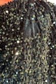The dress is very pretty, the material does have some give to it, and would recommend sizing down. However, other than trying it on when it came in it's hung in my closet and there's a large section of sequins that are just missing. My return window has closed otherwise I would return the dress. - Shawna W.