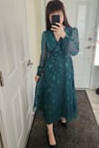 I was nervous about ordering because I am a smaller girl (5ft 1inch, 32A, 26 waist, 35 hip) but the XS fit perfectly! I love that it is a wrap dress because I can tie as I need to for it to fit. The dress is "midi" but it hits me at the ankles since I'm on the shorter side at 5ft 1 inch, but I don't think I will hem it as it is the perfect length for the formal wedding I bought this for. The emerald green colour is sooooo beautiful in person. - Lavina C.