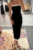 The material hugged my body but didnt restrict my movement. The material was very comfy and not see through. I have a small chest so I ordered a small. I also wore a strapless bra under the dress. - Kendall D.