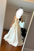 I tried on a lot of lulus dresses, and when I put this one on, I instantly was like wow!! Def need someone else to zip you up cause I really struggled doing it myself, but it fit so perfectly, snug on the top which I thought was great for the corset look- and I got my usual size. Seriously felt like a princess bride. The A-line look with the corset is so flattering and the dress feels expensive. The beading is nice and delicate. I would love this dress if I were to have a wedding but didn't exactly fit for an elopement personally. Wouldn't be a deal breaker, but I didn't rlly love the mesh fabric in between the plunge cut. - Jamie D.