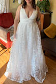 This dress is so dreamy and beautiful.  It felt so nicely made for the cost.  It was a little snug in the ribcage area and definitely showed too much cleavage (could have altered for that reason though).  However, decided on a different style. - Erinn P.