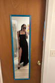 It's a beautiful dress, but the material isn't as great as I would've liked. It is a very high slit. It was super flattering but unfortunately, the zipper would NOT zip up all the way. It kept getting stuck on the bust line and I had plenty of room. I did read in other reviews that the zipper was an issue so just be aware. For the life of me, even with help, the zipper would not budge. Sadly had to return due to this problem! - Kayla L.