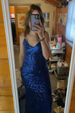 It looks better in person than the picture i think. The chest is a little low so if you don't want to show much, this isn't the dress for you. I sized down so it'd be snug and it is. I'm 5'8 and it's long enough where l step on the train. I have wide hips and it fit good/ flattering - Gianna O.