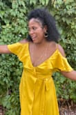 Love this dress. Awkward fit in the bust area. Small cups and button does not stay closed. But love the length and flowing features on dress. - Jade G.