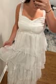 Needs a good steaming to get the wrinkles out, but super cute dress to wear at my wedding rehearsal party. The bow straps are great so you can have the sleeves exactly how you want to fit. The sparkles/shimmer doesn't picture well, but in person, it is so cute! Such a fun dress for a bridal event! - Jo T.