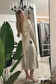 I was v impressed with the thickness of the dress material. It helps the dress lay very nicely and not look cheap. I wore this dress for my February engagement party so it was cold outside but I paired it with a white jacket and I got so many compliments. The shoulders fall off v easily so I safety pinned the sleeves to my bra straps and that worked perfectly. - Emma G.