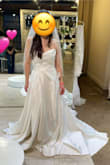 This dress blew me away. It's just like the 2-3k dresses I tried on! It looked amazing on. The pictures don't do it justice, partially because it needed some steaming. But it was light and simple but just enough structured. You could dance in this easily. I ended up picking a different style of dress, but man this is a great option if it's the style you're looking for. The top was structured in the bust area and everything. If you wanted to add buttons down the back, that would be really easy to do.

If you're confused by the pictures, I brought the dress with me to a store to compare it to some high end dresses and it stood up! - Samantha S.