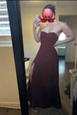 I like this dress. It's simple and understated but the texture of the burnout lace and the slit are nice touches. It is too large in the top, I'll have to have it taken in some, but it fits my hips well and doesn't cling, so that's a win! Seems like it'll stay up well once I get it tailored. It's very comfortable fabric, not itchy at all.

Close up shows the color and fabric in the sunlight. - Sophia V.