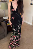 This dress was absolutely stunning! Overall, it fit loosely in the waist and chest but fits perfectly in the hips. I had to get it hemmed and brought in, but other than that, it was my dream dress. The picture shows before I got it altered, and I was wearing 3-inch heels. - Catherine J.