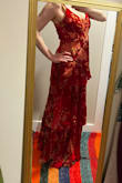 Normally, I would prefer natural fibres, but I really wanted a velvet dress, and natural fibres are way more expensive, of course. This is rayon, semi-natural and lined with synthetic, but it's light and soft. The colour is rich and bright, and I love it. Some reviews mention the straps coming off. Mine are sewn on properly, but with much wear, I could see them wearing out at that very thin point, but you just unpick the edge and sew them in again, not a problem. I got large because I have a bit of a tummy. It feels like it fits perfectly, and I usually take a medium in things. I might take a couple of stitches under the arms, but I don't need to. It is too long for me, but there is the perfect spot to pin it or sew it up a few inches, under the top layer of skirt, in the lining material! Invisible even if I don't sew it perfectly. Yes!! Thanks lulus. - Vandi