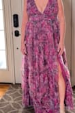 Looked at other reviews and I did size up. Fit perfectly. The material is so light and flowy and is fully lined underneath. It is pretty open and low at the sides for me I plan to just stitch it a little closed just so I'm more comfortable not showing too much at my age! I had on heels and dress was perfect for me lengthwise which normally everything is too short on me. Great quality dress!! - Pam C.