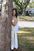 The dress came super fast it took about two days! And it was beautiful not see through at all !! thick and it was a hit at my wedding everyone loved it. If you're going for something simple I recommend this dress. I will add I'm only 5'4 so I did get it tailored and wore 2 inch heels. - Janais R.