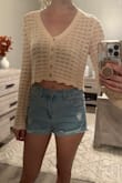 It's not bad, but I don't think I'll wear it with how cropped it is. In the picture, it looks like a normal length shirt, but when I put it on, I feel like it looks awkwardly short. Will most likely return. - Laura H.