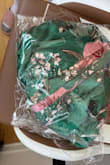 Hello, I don't like the material of this dress and it doesn't fit me so I would like to return it. - Esty L.