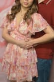 I was online shopping for a pink dress to wear on Valentine's Day this year, and never bought from Lulus before. After reading some reviews, I bought this dress and fell in love when I first tried it on. I wore it on my Valentine's Day photoshoot at Tom's 1 Hr Photo in Los Angeles and even installed tinsels in my hair so it could match the gold streaks on the dress. It was a good fit for my petite-ness. the only downside was that the sleeves and front of the dress fit loose so I had to wear lots of body tape on my shoulders and chest so I didn't accidentally flash someone. I'd recommend to manufacturing if this dress could be modified with some adhesive around the shoulder and back area so it sticks well to the upper body. - Itzel C.