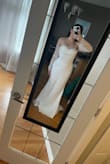 Beautiful dress! The bodice has no give to it and can be a little tight so be careful with sizing, especially if you have a larger bust/rib cage. I'm 4.11 and wearing 4 inch heels and will need to get the length hemmed. Excited to wear it for my upcoming elopement! - Lawren F.