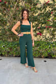 I love this jumpsuit! The color is a deep green and perfect. I love the neckline, it's super flattering. I paired it with a raffia belt and shoes to match. Chefs kiss! I'm 5'11 and the 34" inseam is perfect and super hard to find for a jumpsuit! I was between a medium and large so bought both and ended with the medium. It was a little tight in the hips but the stretchy material made it comfortable enough! The large was definitely too big. I received many compliments and it was an excellent last minute add for my conference in Florida! - Kristi M.