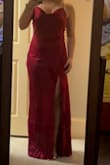 this dress is so pretty and gorgeous! Fits true to size but a tiny bit loose in the back at the waist. It doesn't bother me but maybe someone else. I love the subtle button detail! It is floor length with 3ish inch heels on and I am 5'7. Super cute for prom! - Lily X.